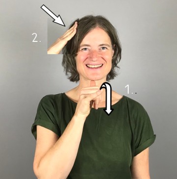 Porträtfoto Frau Jakob. Kinnlanges dunkelbraues Haar, helle Haut.